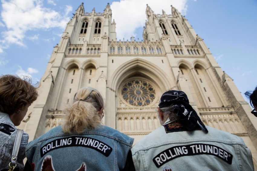 Members of Rolling Thunder listen during the "Blessing of the Bikes" ceremony at National Cathedral in Washington, May 23, 2014. National Cathedral welcomed members of Rolling Thunder XXVII ahead of their annual ride on the Memorial Day weekend.