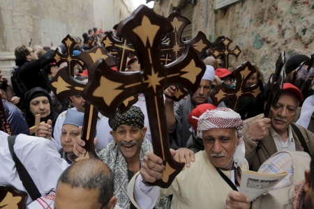 Egyptian Coptic Christian worshippers carry crosses during a procession along the Via Dolorosa on Good Friday during Holy Week in Jerusalem's Old City, April 10, 2015. Christian worshippers on Friday retraced the route Jesus took along Via Dolorosa to his crucifixion in the Church of the Holy Sepulchre. Holy Week is celebrated in many Christian traditions during the week before Easter.