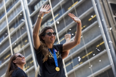 Tobin Heath (C) of the U.S. women's soccer team cheers during the ticker tape parade to celebrate the U.S Team's World Cup final win over Japan on Sunday, in New York, July 10, 2015. Screams and a blizzard of confetti cheered the World Cup winning U.S. women's soccer players as they rolled up New York City's 