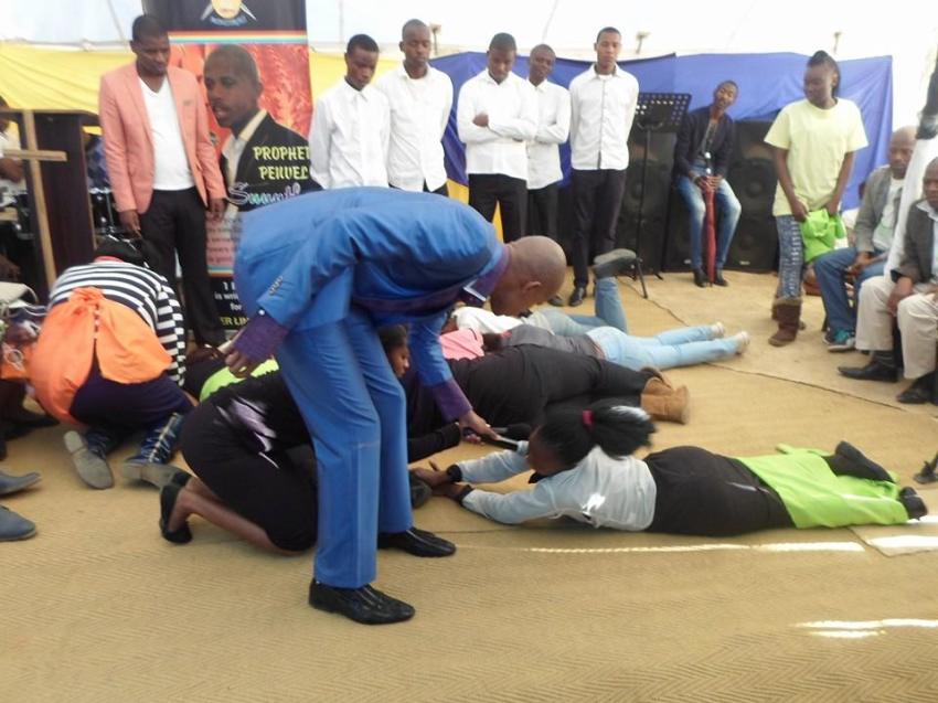 South African prophet Penuel Mnguni, 24, commanding "snake spirits" into his congregants.