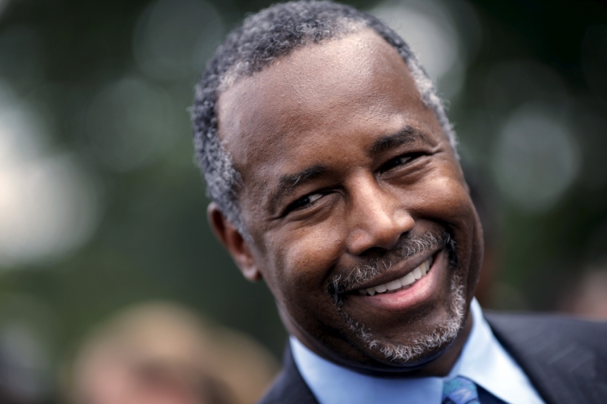 Republican presidential candidate Dr. Ben Carson smiles as he talks to reporters after speaking at the "Women Betrayed Rally to Defund Planned Parenthood" at Capitol Hill in Washington July 28, 2015.