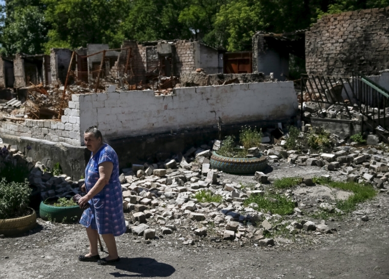 A local resident is seen in the village of Novotoshkivske near the frontline with pro-Russian separatists, eastern Ukraine, June 8, 2015.