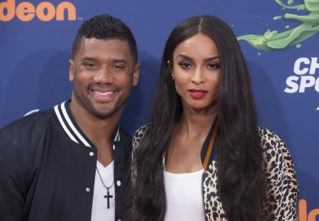 NFL player Russell Wilson (L) and recording artist Ciara attend Nickelodeon's