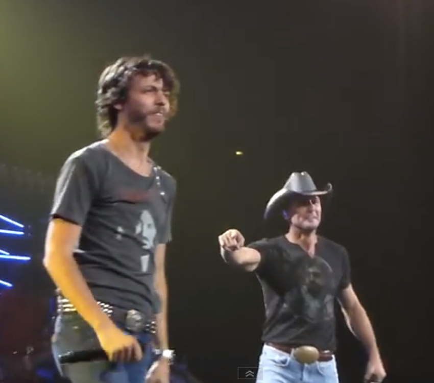 Country music singers Chris Janson and Tim McGraw perform