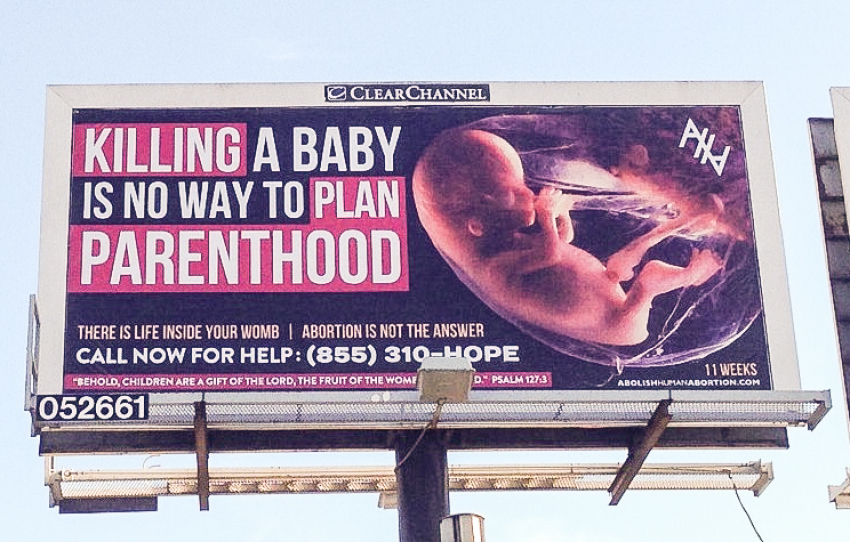 Billboard reading "Killing A Baby Is No Way To Plan Parenthood" pictured next to an eleven week fetus, erected in Columbus, Ohio, in November 2015.