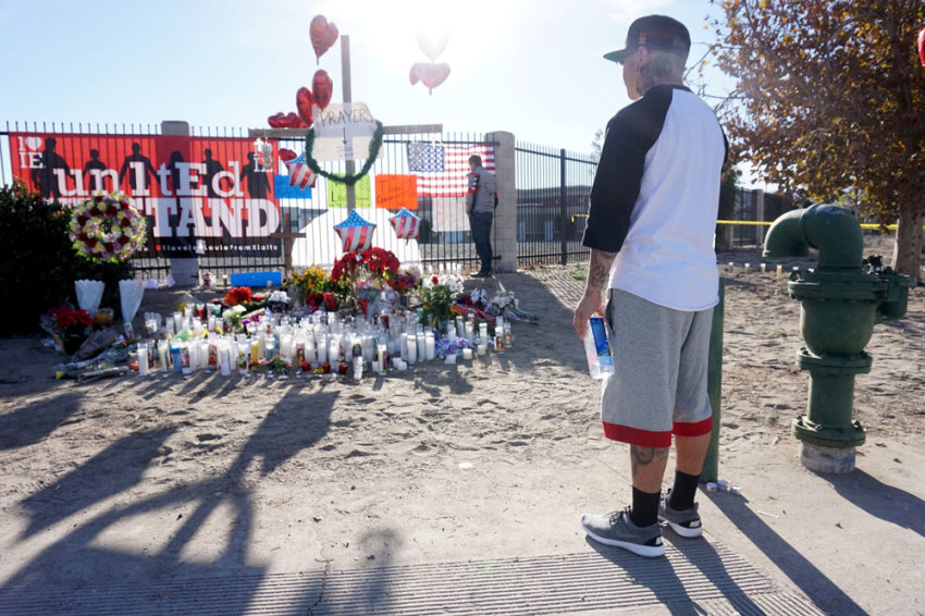 Mourners gather at a makeshift shrine to pay their respects to the victims following Wednesday's attack in San Bernardino, California December 5, 2015. Authorities are investigating the shooting as an