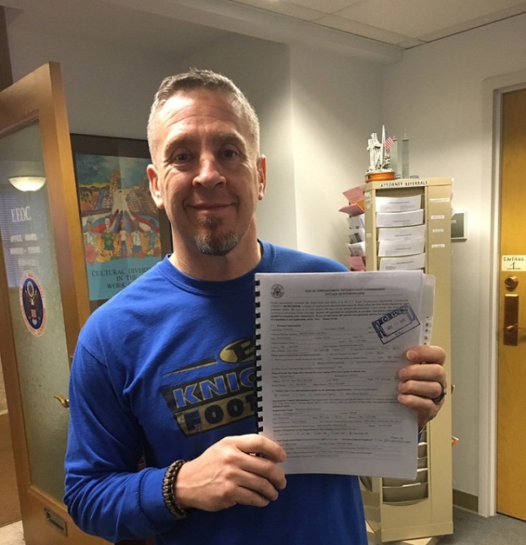 Coach Joe Kennedy filing his complaint with the Equal Employment Opportunity Commission in December 2015 against Bremerton School District. | Courtesy Liberty Institute