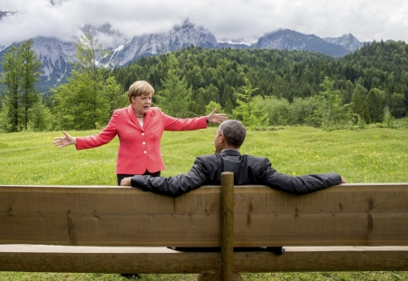 German Chancellor Angela Merkel speaks with U.S. President Barack Obama outside the Elmau castle in Kruen near Garmisch-Partenkirchen, Germany, June 8, 2015. Leaders of the Group of Seven (G7) industrial nations vowed at a summit in the Bavarian Alps on Sunday to keep sanctions against Russia in place until President Vladimir Putin and Moscow-backed separatists fully implement the terms of a peace deal for Ukraine.