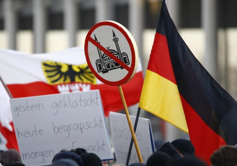 Supporters of anti-immigration right-wing movement PEGIDA (Patriotic Europeans Against the Islamisation of the West) take part in in demonstration rally, in reaction to mass assaults on women on New Year's Eve, in Cologne, Germany, January 9, 2016. Placard reads: