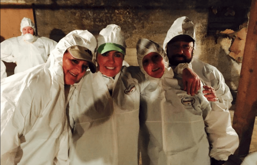 Volunteers cleaning up a basement at a men's shelter in Tennessee as part of the annual ecumenical community volunteer event 