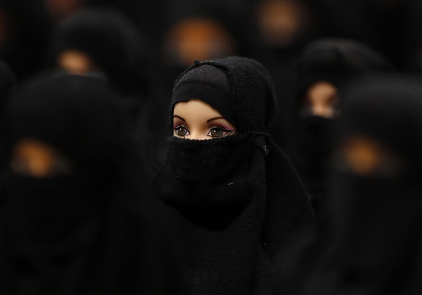 The installation "Sheltered position" of German artist Sabine Reyer shows one hundred Barbie dolls dressed with burkas at the Ruhr-Biennale in Dortmund, Germany, October 7, 2012.