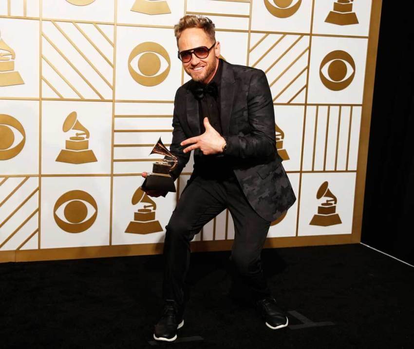 Tobymac holds the award for Best Contemporary Christian Music Album for "This Is Not A Test" during the 58th Grammy Awards in Los Angeles, California February 15, 2016.