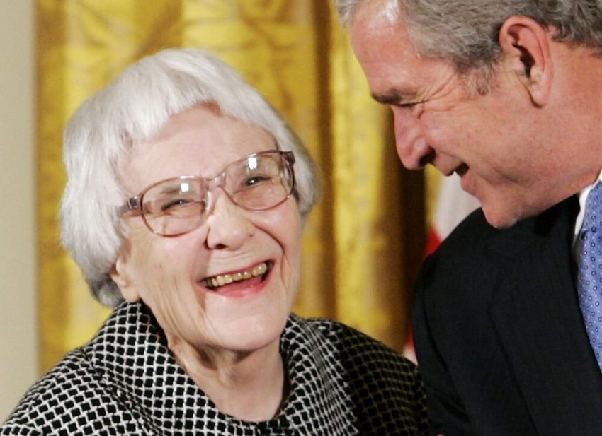 U.S. President George W. Bush (R) before awarding the Presidential Medal of Freedom to American novelist Harper Lee (L) in the East Room of the White House, in this November 5, 2007, file photo. Lee, who wrote one of America's most enduring literary classics,