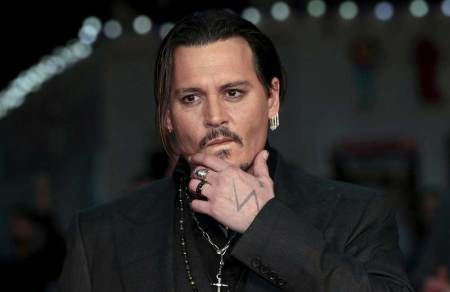 Actor Johnny Depp arrives for the British premiere of the film "Black Mass" in London, Britain October 11, 2015.