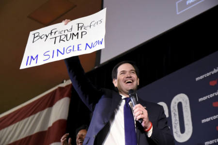 Republican U.S. presidential candidate Marco Rubio holds up a supporter's signage that reads