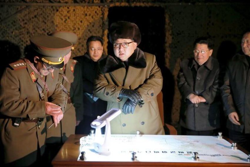 North Korea’s leader, Kim Jong-un, center, at a rocket launch drill, in a photo released March 11.
