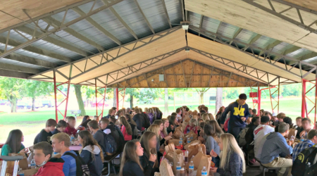 Students eating at the weekly gathering known as
