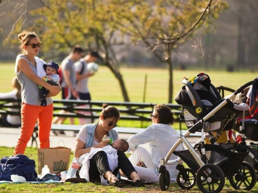 A couple of mothers enjoying the sun.