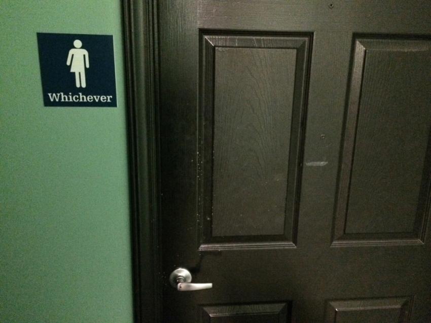 A bathroom sign welcomes both genders at a restaurant in Durham, North Carolina May 5, 2016. The restaurant installed the sign after North Carolina's 
