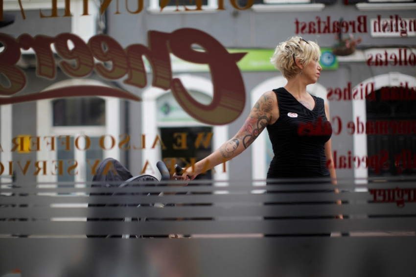 A woman wears the sticker 
