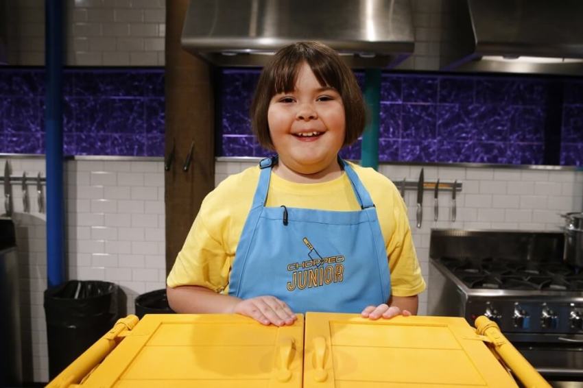 9-year-old junior chef Lucy Chelton, daughter of a United Methodist pastor, poses at her station on the Food Network competition "Chopped Junior."