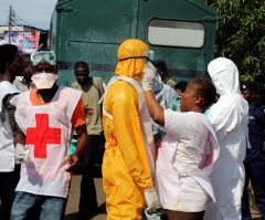 Ebola Death Rate Rises Sharply to Over 20 Per Day in Sierra Leone; Curfew Imposed After Riots