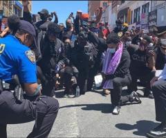 Police officers nationwide pray, kneel with protesters: ‘A sign of hope in America’