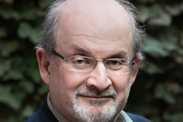 Salman Rushdie, author of ‘Satanic Verses,’ remains hospitalized after stabbing attack in New York