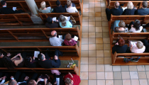 A third of Americans say they attend religious services at least once per month, survey finds