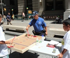 NYC Police Athletic League Hosts 'Play on Wall Street' With Chris Canty and Commissioner Kelly