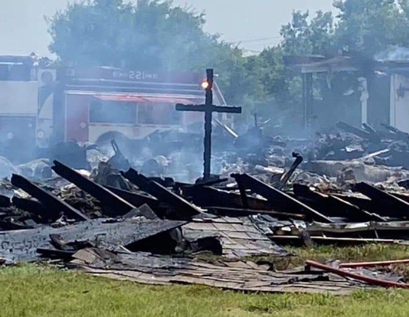 Wooden cross is only thing left standing after historic church burns down: 'A sign from the Lord'