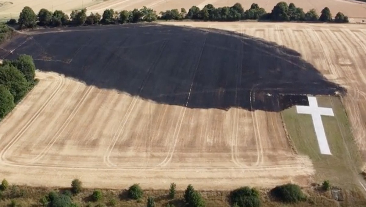 England's Lenham cross unscathed after field fire scorches ground World