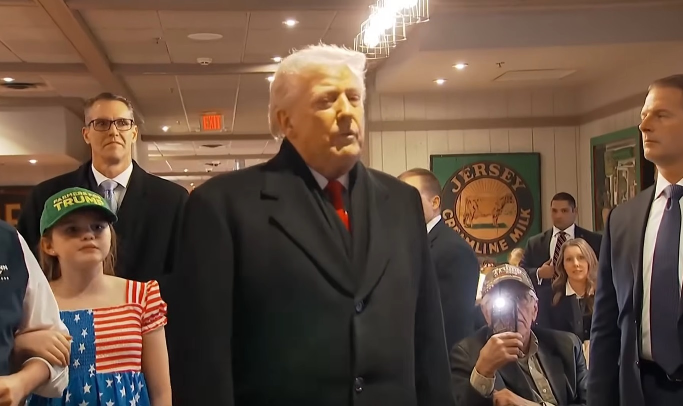 Trump prays with supporter during campaign stop in Iowa