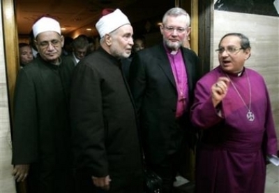 From left, Al-Azhar Sheikh Omar Al-Deeb, Egypt's highest Islamic authority, Mohammed Sayyed Tantawi, the grand sheik of al-Azhar, Danish Bishop Karsten Nissen and Episcopal Bishop for Egypt Moneer Anis leave Tantawi's office after their meeting in Cairo,