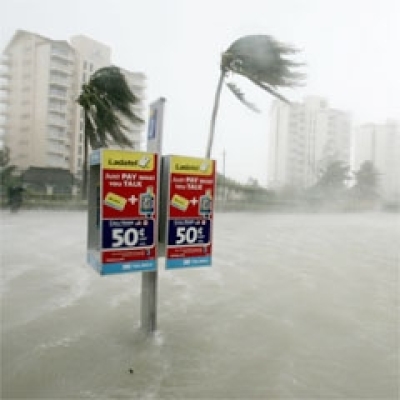 A public phone is surrounded by floodwaters near a block of hotels as Hurricane Wilma lashes Cancun. (Photo: AP /Jose Luis Magana)
