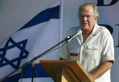 Evangelical broadcaster Pat Robertson, backed by an Israeli flag, delivers a speech to a crowd of mostly Evangelical Christians from various nations on a pilgrimage to Israel, during an event of the International Christian Embassy in Jerusalem.