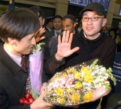 Seok waves to supporters who at the aiport in South Korea National Press Photographer's Association