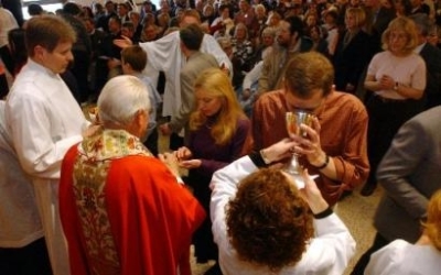 Clergy perform communion at Presentation of Our Lord Church in Fairlawn, Ohio, Sunday, March 14, 2004. The church confirmation service combined six defiant congregations and was led by visiting bishops who acted without required permission from the Dioces