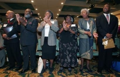 Progressive National Baptist Convention members sing praises during a prayer service at the Joint Winter Board Meeting of the National Baptist Conventions in Nashville, Tenn., on Jan. 26, 2005. 