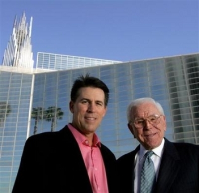 Robert A. Schuller, left, poses for a photo with his father, Robert H. Schuller, outside the Crystal Cathedral Feb. 9, 2006, in Orange, Calif. (File)