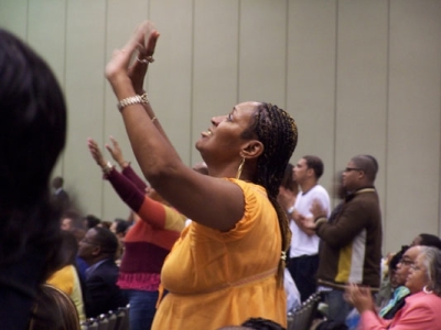 Pentecostals raise their hands in worship at the Azusa East Centennial Celebration in Baltimore, Md., on Friday, May 26, 2006.