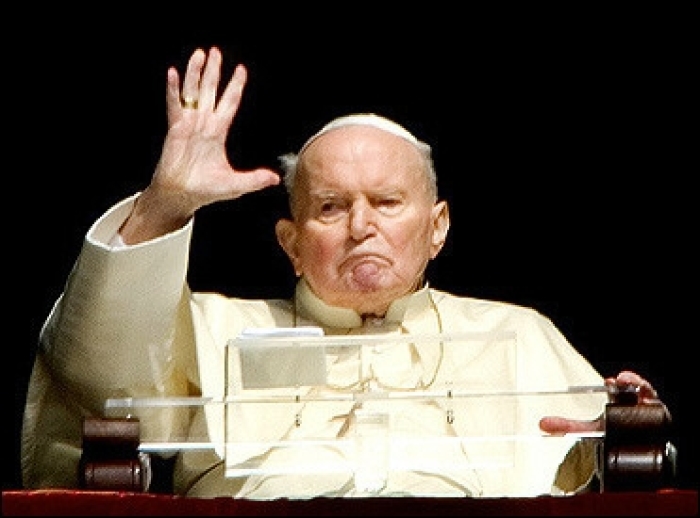 Pope John Paul II blesses pilgrims from his apartment's window at the Vatican. The Pope, barely able to make a rasping sound during his appearance, is now being fed through a tube in his nose, the Vatican said. (Photo: AFP / Vincenzo Pinto)