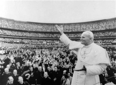 Pope John Paul II gestures to the crowd at New York's Shea Stadium after his arrival October 3, 1979. 