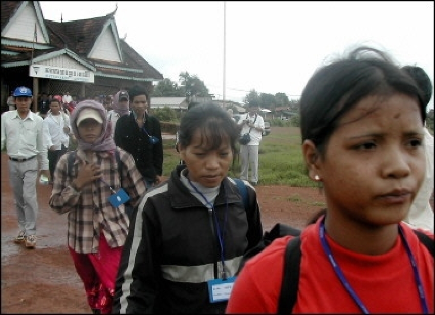 Vietnamese Montagnards walk to their airplane in Banlung, Ratanakiri province to be airlifted to Phnom Penh. Hundreds of Vietnamese Montagnards have fled the repressive Vietnamese government on foot to Cambodia hoping for better lives abroad.