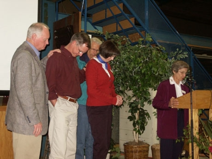 From Left to Right - Ron Pritz - MAF Chairman of the Board, Kevin Swanson - MAF, CEO, Linda Swanson - wife of Kevin Swanson, Dan Shaw - MAF Board Member, Larrie Gardner - MAF Board Member. Larrie Gardner praying for Kevin and Linda at the CEO's installat