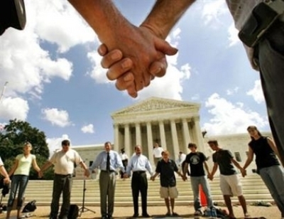 (Photo: AP / Pablo Martinez Monsivais) Pro-life supporters join hands in front of the Supreme Court, Sept. 5, 2005. 