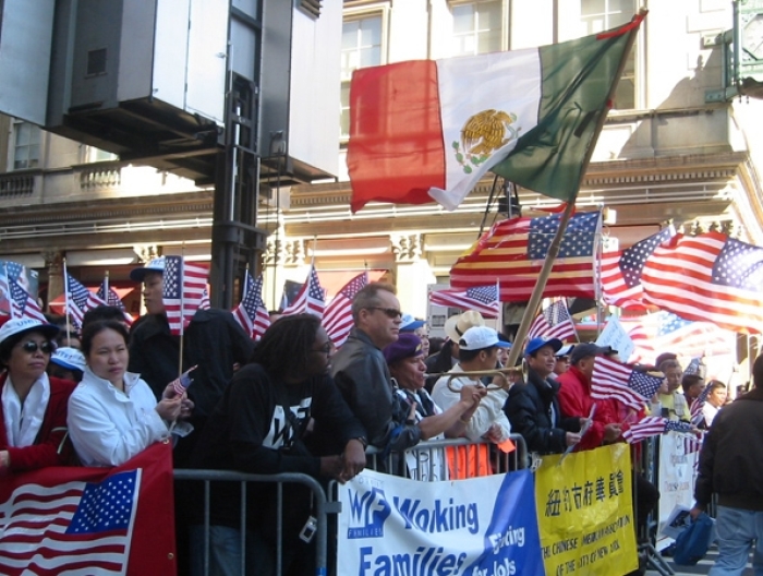 Diverse crowds numbering tens of thousands holds American and Mexican flags in a four-hour mass action rally in New York City. 