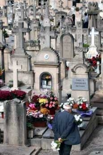 A man stands amongst tombstones during a visit to the Palma de Mallorca cemetery at the Spanish island of Mallorca on All Saints Day Nov. 1, 2005. Catholics in Spain mark November 1 by visiting cemeteries and gravesides of deceased relatives and friends to remember the dead. (Photo: Reuters/Dani Cardona)