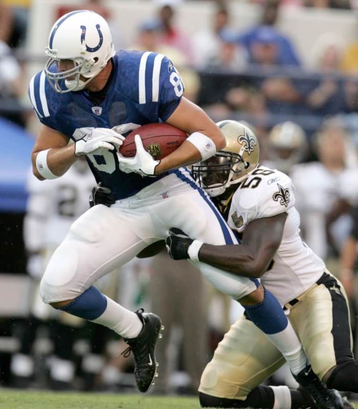 Indianapolis Colts tight end Ben Utecht (L) is tackled by New Orleans Saints line backer Alfred Fincher in the first quarter of their NFL preseason game in Jackson, Mississippi on August 26, 2006.