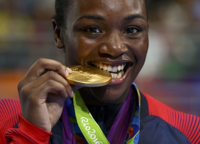 Gold medallist Claressa Shields (USA) of USA bites her Olympic medal, Rio de Janeiro, Brazil, August 21, 2016.